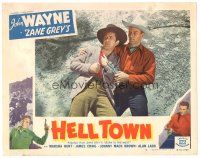 1c251 BORN TO THE WEST LC #4 R50 c/u of John Wayne helping wounded man, Zane Grey, Hell Town!