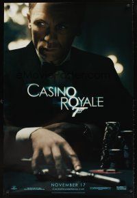 1g117 CASINO ROYALE teaser DS 1sh '06 Craig as James Bond sitting at poker table w/gun!
