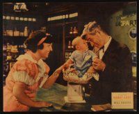 1k042 HANDY ANDY jumbo LC '34 druggist Will Rogers weighs baby on his scale!