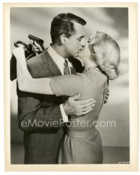 1m486 NORTH BY NORTHWEST 8x10 still '59 Cary Grant kisses Eva Marie Saint with gun behind his back