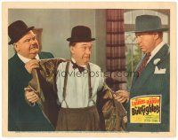 1s319 BULLFIGHTERS LC '45 Oliver Hardy removes Stan Laurel's coat as Ralph Sanford threatens them.