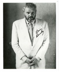 2a713 BRIAN DENNEHY signed 8x9.75 REPRO still '80s full-length in suit & tie with a beard!