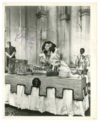 2a383 SOPHIA LOREN signed 8x10 still '70s holding a plate & showing her cleavage!