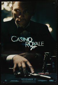 2c126 CASINO ROYALE teaser DS 1sh '06 Daniel Craig as James Bond sitting at poker table w/gun!