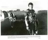 2g528 MAD MAX 2: THE ROAD WARRIOR 7.75x9.5 still '82 classic image of Mel Gibson on road by car!