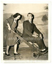 2g698 SHADOW OF A DOUBT candid 8x10 still '43 Wright gives Joseph Cotten a ride on baggage wheeler!