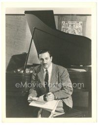 2g816 WALT DISNEY deluxe 8x10 still '30s great close up sitting by piano & going over paperwork!