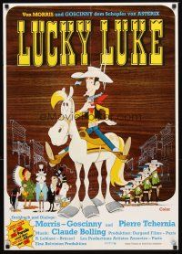 2m203 LUCKY LUKE German '72 Daisy Town, great western cartoon artwork of cowboy on horse!