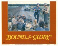 2p335 BOUND FOR GLORY LC #3 '76 David Carradine as folk singer Woody Guthrie plays guitar for kids