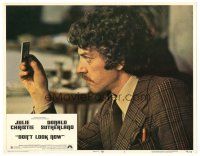 2p453 DON'T LOOK NOW LC #3 '74 c/u of Donald Sutherland looking at slide, directed by Nicolas Roeg