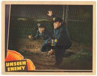 2p960 UNSEEN ENEMY LC '42 German officers Don Terry & Lionel Royce cut a hole in a fence!