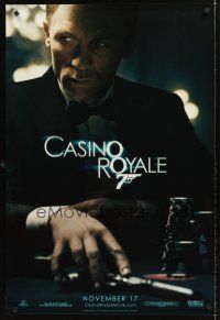2t129 CASINO ROYALE teaser DS 1sh '06 Daniel Craig as James Bond sitting at poker table w/gun!