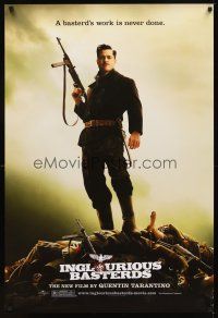 2t358 INGLOURIOUS BASTERDS teaser DS 1sh '09 Quentin Tarantino, Brad Pitt standing on pile of Nazis