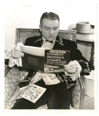 2s464 JAMES CAGNEY 8x9.25 still '42 seated in costume looking at book of stamps by Madison Lacy!