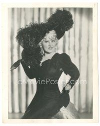 2s571 MAE WEST deluxe 8x10 still '30s full-length seated close up in sexy dress & feathered hat!
