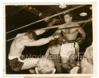 2s745 ROCKY MARCIANO 7.25x9 news photo '53 knocking boxing opponent LaStarza through the ropes!