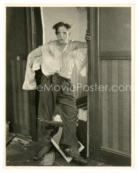 2s826 STAN LAUREL 7.5x9.75 still '20s wacky full-length portrait looking battered in torn clothes!
