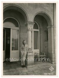2s534 LILLIAN HARVEY German 7x9 still '30s great portrait in suit standing outside her home!