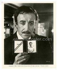 3c760 RETURN OF THE PINK PANTHER 8x10 still '75 great c/u of Peter Sellers flashing his badge!