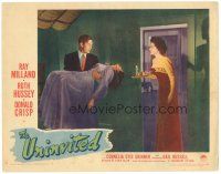 3e931 UNINVITED LC #8 '44 Ruth Hussey with candle looks at Ray Milland carrying Gail Russell!