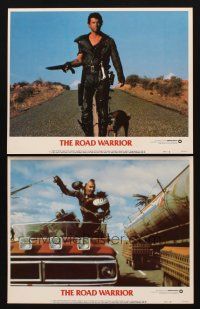 3h935 MAD MAX 2: THE ROAD WARRIOR 2 LCs '82 Mel Gibson as Mad Max, great image walking down road!