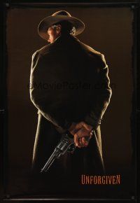 3z842 UNFORGIVEN undated teaser 1sh '92 classic image of gunslinger Clint Eastwood w/back turned!