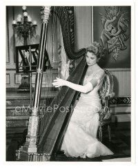 4b350 GRACE KELLY candid deluxe 8x10 still '56 trying her hand at the harp between scenes!