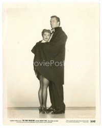 4b559 MAD MAGICIAN 8x10 still '54 full-length Vincent Price wraps sexy Mary Murphy in his cape!