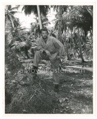 4b738 ROBERT MITCHUM 8x10 still '57 great close up smoking portrait standing in the jungle!