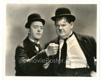 4b907 WAY OUT WEST 8x10 still '37 Oliver Hardy is confused at what Stan Laurel has in his hand!