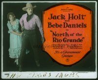 4e114 NORTH OF THE RIO GRANDE glass slide '22 c/u of cowboy Jack Holt protecting Bebe Daniels!