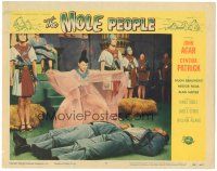 4d628 MOLE PEOPLE LC #8 '56 woman in wacky costume stands over unconscious men in throne room!