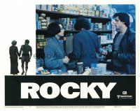 4d767 ROCKY LC #7 '76 Sylvester Stallone tries to talk to Talia Shire at the grocery store!