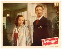 4d965 WHEN STRANGERS MARRY LC #2 R48 close up of young Robert Mitchum & Kim Hunter, Betrayed!