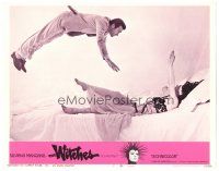 4d978 WITCHES LC #7 '67 cool close up of Clint Eastwood floating in mid-air over Silvana Mangano!