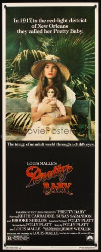 4g537 PRETTY BABY insert '78 directed by Louis Malle, young Brooke Shields sitting with doll