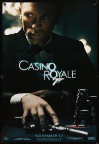 5b118 CASINO ROYALE teaser 1sh '06 Craig as James Bond sitting at poker table w/gun!