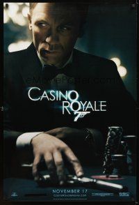5b119 CASINO ROYALE teaser DS 1sh '06 Craig as James Bond sitting at poker table w/gun!