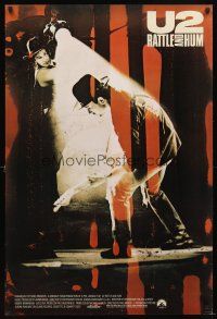 5b753 U2 RATTLE & HUM int'l 1sh '88 image of Irish rockers Bono & The Edge performing on stage