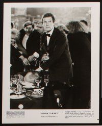 5h395 VIEW TO A KILL presskit w/ 6 stills '85 Roger Moore as James Bond, Grace Jones, Walken!