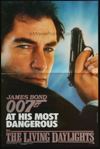 5h421 LIVING DAYLIGHTS promo brochure '87 most dangerous Timothy Dalton as James Bond with gun!