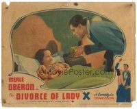 5y366 DIVORCE OF LADY X LC '38 Laurence Olivier looking angrily at Merle Oberon in bed!
