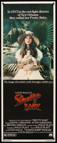 5z651 PRETTY BABY insert '78 directed by Louis Malle, young Brooke Shields sitting with doll