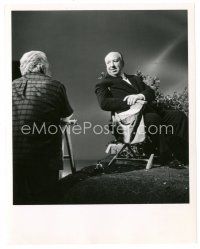 6m067 ALFRED HITCHCOCK 7.25x9 still '60s great candid image sitting in his chair on the set!