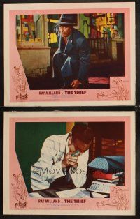 6w968 THIEF 2 LCs '52 close up of Ray Milland in trench coat & hat crouching on street!