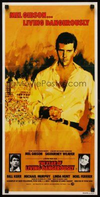 7c991 YEAR OF LIVING DANGEROUSLY Aust daybill '82 Peter Weir, artwork of Mel Gibson by Stapleton!
