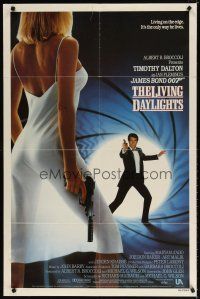 7h535 LIVING DAYLIGHTS int'l 1sh '87 Dalton as Bond & sexy Maryam d'Abo in sheer dress w/gun!