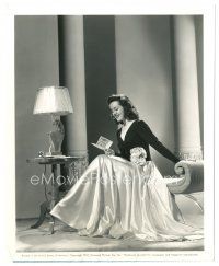 7s695 PEGGY MORAN 8x10 still '41 smiling in beautiful satin gown reading Christmas card!