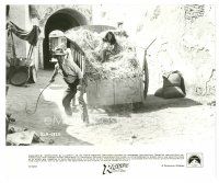 7s719 RAIDERS OF THE LOST ARK 8x9.75 still '81 Harrison Ford w/ whip protects Karen Allen in hay!