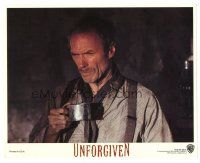 7s062 UNFORGIVEN 8x10 mini LC '92 great close up of tough Clint Eastwood holding tin cup!